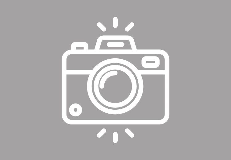 Ikon av et kamera med blinkende lys som illustrasjon