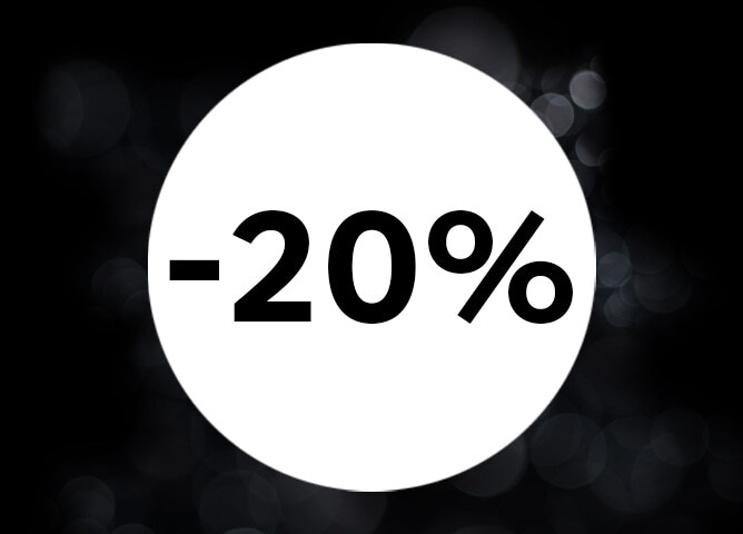 Hvit sirkel med teksten «-20 %» på en mørk bakgrunn med lysrefleksjoner