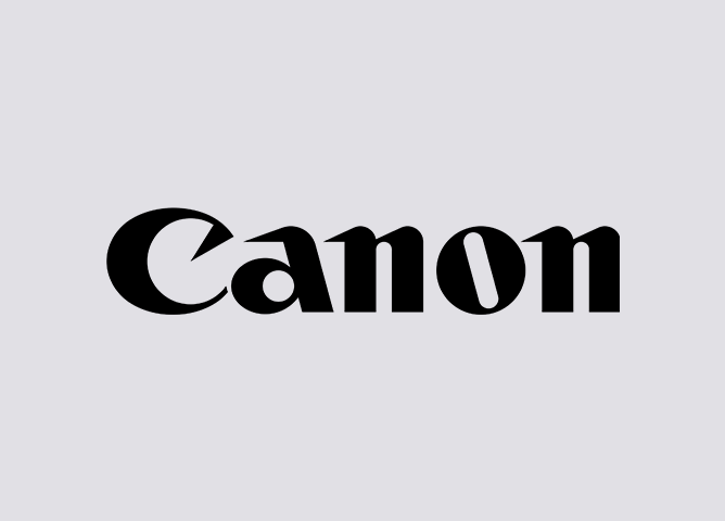 Canon-logo i svart tekst på grå bakgrunn