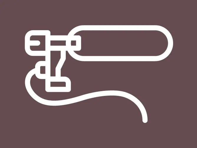 Ikon av en tannlegebor med en kabel, hvit linjetegning på brun bakgrunn